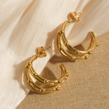 Elegant gold hoop earrings with layered crescent design, modern statement jewelry for parties and festive occasions