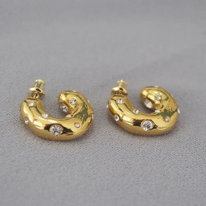 Trendy gold-tone chunky hoop earrings with rhinestone shine, perfect statement jewellery for party and festive wear.