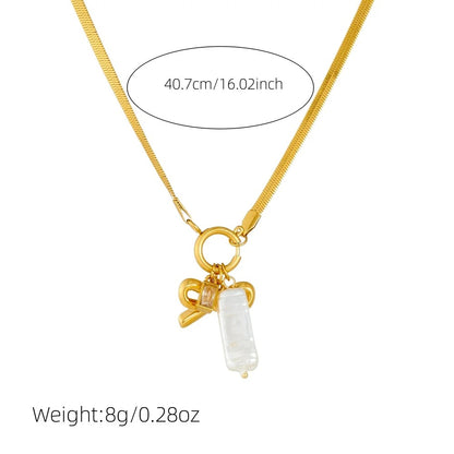 Gold necklace with a bow and rectangular pendant on a white background